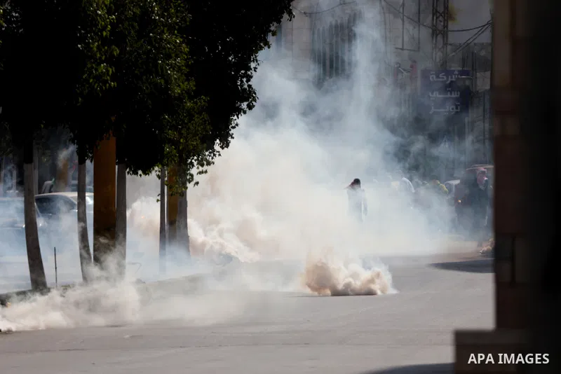 Palestinian protesters clash with Israeli forces following a demonstration calling for the release of Palestinian prisoners on hunger strike in Israeli jails, in the West Bank city of Hebron on October 24, 2021. Seven Pa...