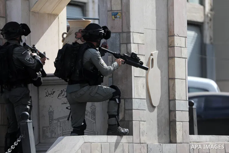 Palestinian protesters clash with Israeli forces following a demonstration calling for the release of Palestinian prisoners on hunger strike in Israeli jails, in the West Bank city of Hebron on October 24, 2021. Seven Pa...