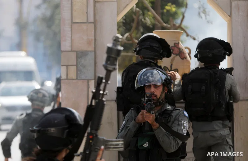 Palestinian protesters clash with Israeli forces following a demonstration calling for the release of Palestinian prisoners on hunger strike in Israeli jails, in the West Bank city of Hebron on October 24, 2021. Seven Pa...