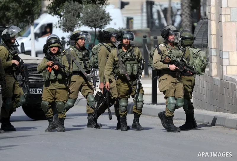 Palestinian protesters clash with Israeli forces following a demonstration calling for the release of Palestinian prisoners on hunger strike in Israeli jails, in the West Bank city of Hebron on October 24, 2021. Seven Pa...