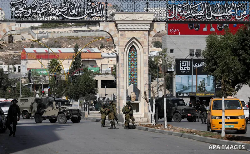 Palestinian protesters clash with Israeli forces following a demonstration calling for the release of Palestinian prisoners on hunger strike in Israeli jails, in the West Bank city of Hebron on October 24, 2021. Seven Pa...
