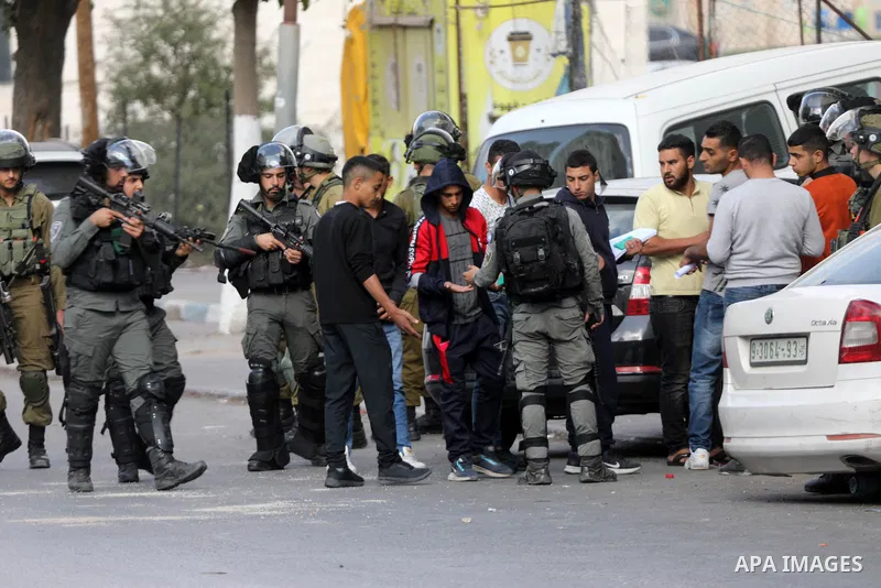 Palestinian protesters clash with Israeli forces following a demonstration calling for the release of Palestinian prisoners on hunger strike in Israeli jails, in the West Bank city of Hebron on October 24, 2021. Seven Pa...