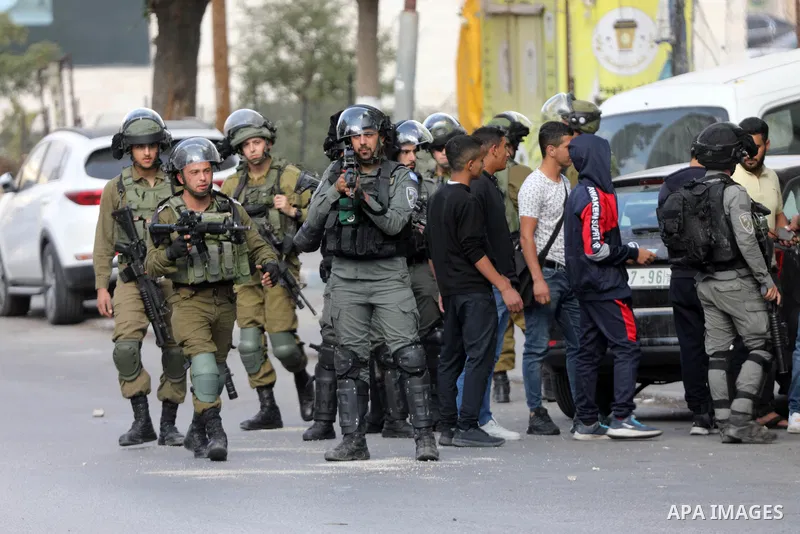 Palestinian protesters clash with Israeli forces following a demonstration calling for the release of Palestinian prisoners on hunger strike in Israeli jails, in the West Bank city of Hebron on October 24, 2021. Seven Pa...