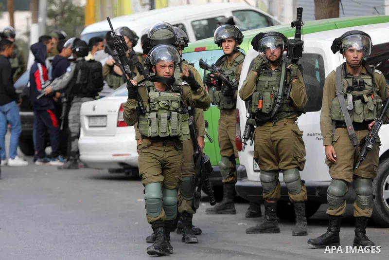 Palestinian protesters clash with Israeli forces following a demonstration calling for the release of Palestinian prisoners on hunger strike in Israeli jails, in the West Bank city of Hebron on October 24, 2021. Seven Pa...