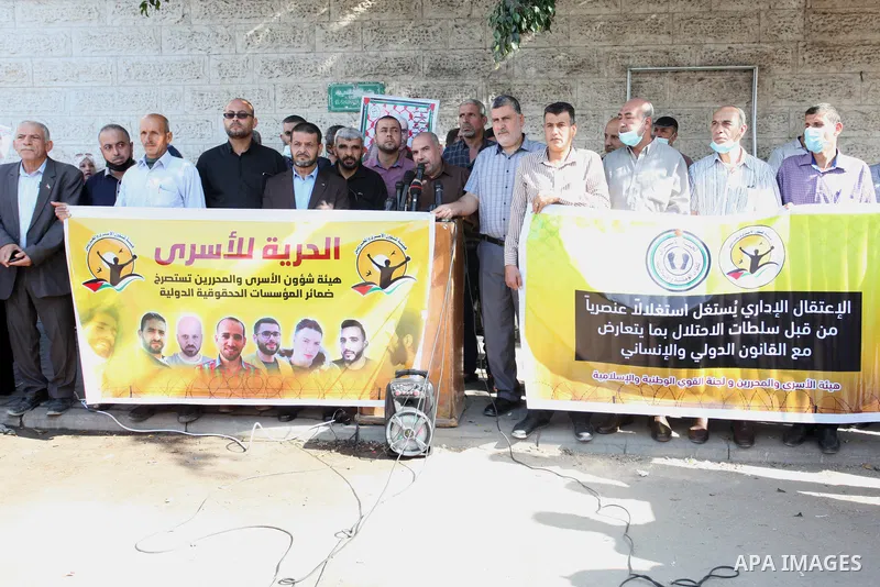Palestinians take part in a protest in solidarity with prisoners on hunger strike at Israeli jails, in front of Red Cross office in Gaza city on October 25, 2021. Photo by Youssef Abu Watfa