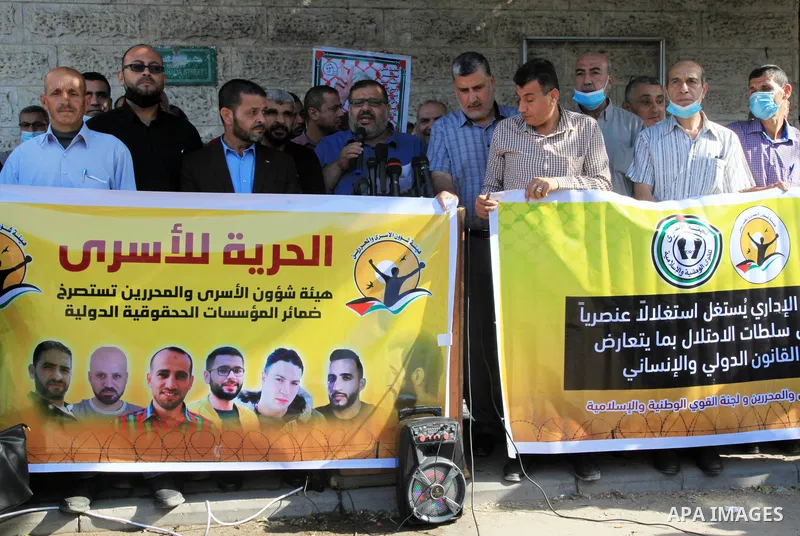 Palestinians take part in a protest in solidarity with prisoners on hunger strike at Israeli jails, in front of Red Cross office in Gaza city on October 25, 2021. Photo by Youssef Abu Watfa