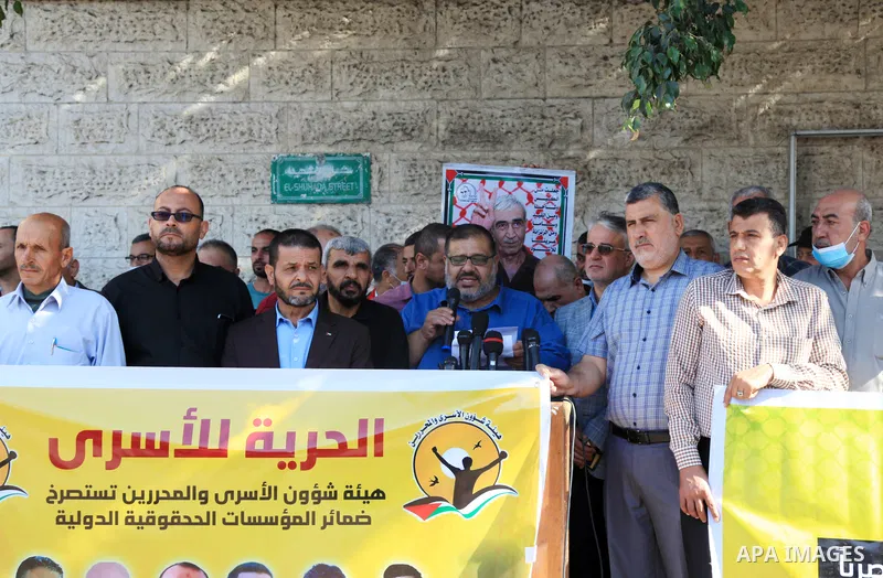 Palestinians take part in a protest in solidarity with prisoners on hunger strike at Israeli jails, in front of Red Cross office in Gaza city on October 25, 2021. Photo by Youssef Abu Watfa