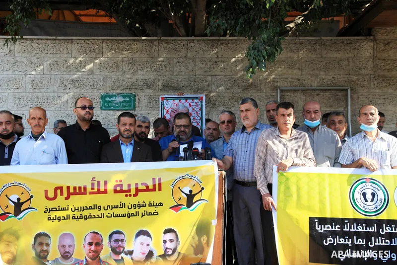 Palestinians take part in a protest in solidarity with prisoners on hunger strike at Israeli jails, in front of Red Cross office in Gaza city on October 25, 2021. Photo by Youssef Abu Watfa