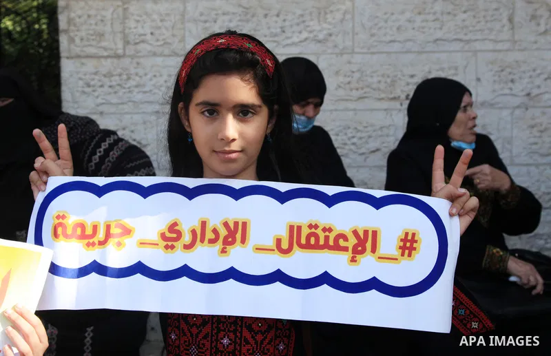 Palestinians take part in a protest in solidarity with prisoners on hunger strike at Israeli jails, in front of Red Cross office in Gaza city on October 25, 2021. Photo by Youssef Abu Watfa