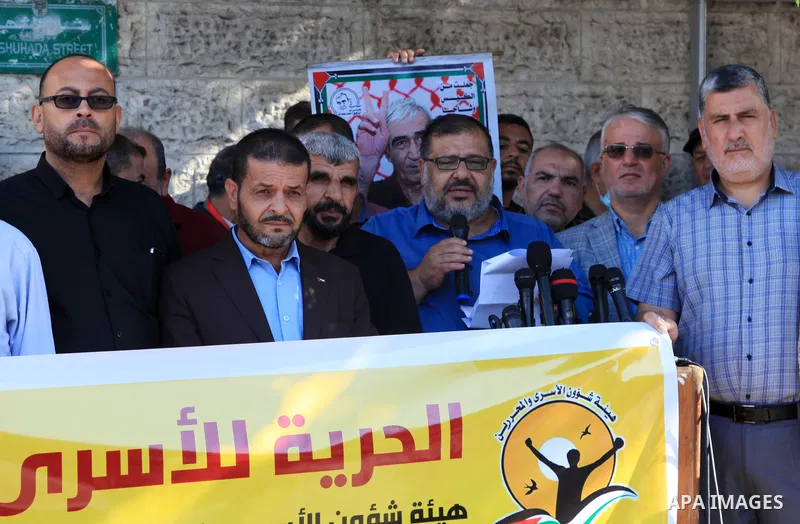 Palestinians take part in a protest in solidarity with prisoners on hunger strike at Israeli jails, in front of Red Cross office in Gaza city on October 25, 2021. Photo by Youssef Abu Watfa