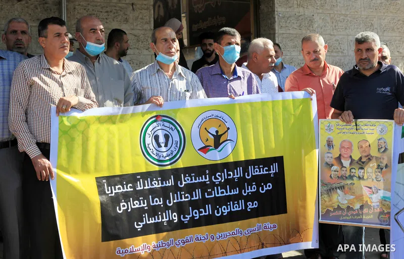 Palestinians take part in a protest in solidarity with prisoners on hunger strike at Israeli jails, in front of Red Cross office in Gaza city on October 25, 2021. Photo by Youssef Abu Watfa