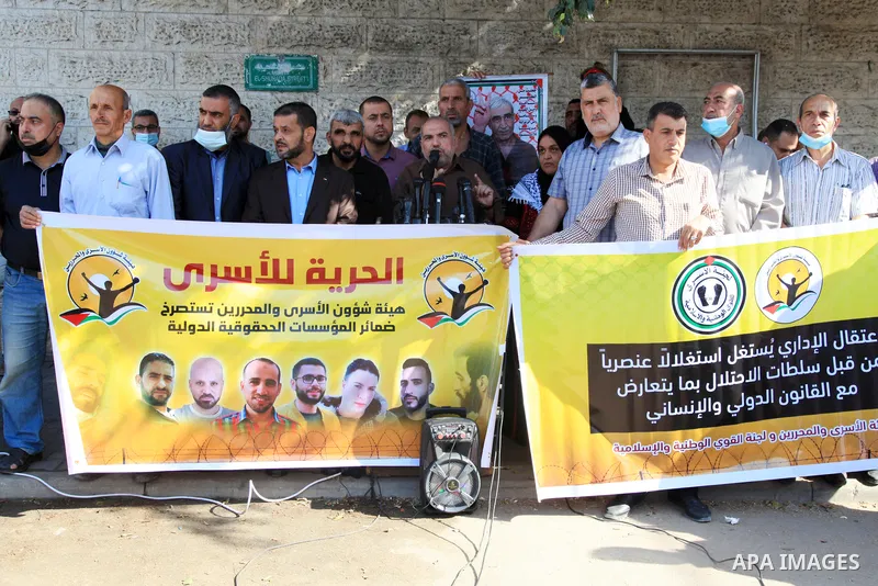 Palestinians take part in a protest in solidarity with prisoners on hunger strike at Israeli jails, in front of Red Cross office in Gaza city on October 25, 2021. Photo by Youssef Abu Watfa