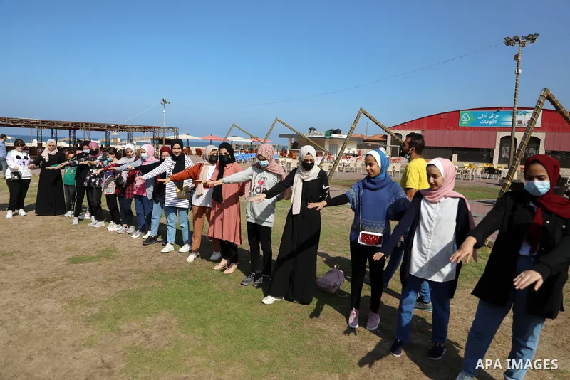 Palestinian girls take part in a fun activity, marking the international day of the girl in Gaza city, on October 25, 2021. The International Day of the Girl Child focuses attention on the need to address the challenges...