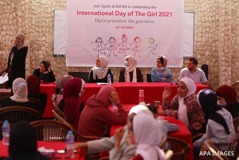 Palestinian girls take part in a fun activity, marking the international day of the girl in Gaza city, on October 25, 2021. The International Day of the Girl Child focuses attention on the need to address the challenges...