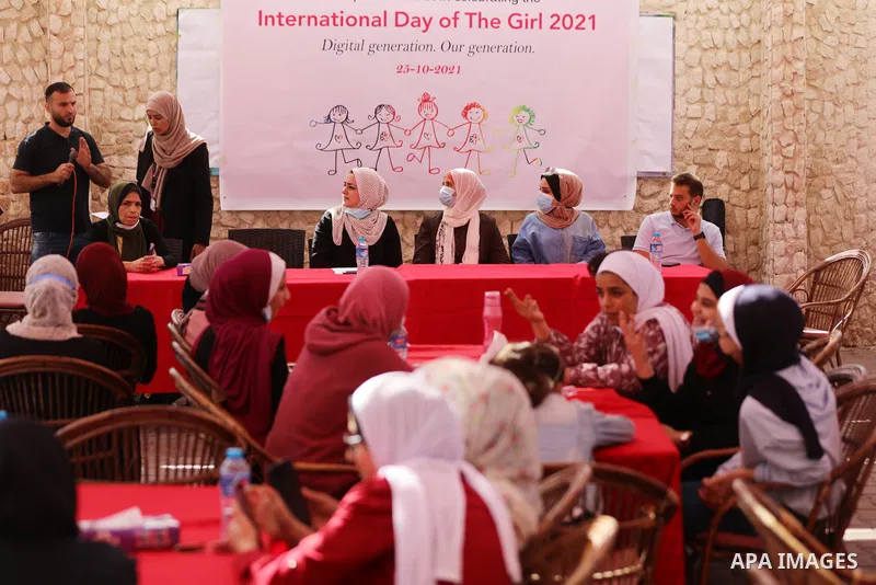 Palestinian girls take part in a fun activity, marking the international day of the girl in Gaza city, on October 25, 2021. The International Day of the Girl Child focuses attention on the need to address the challenges...