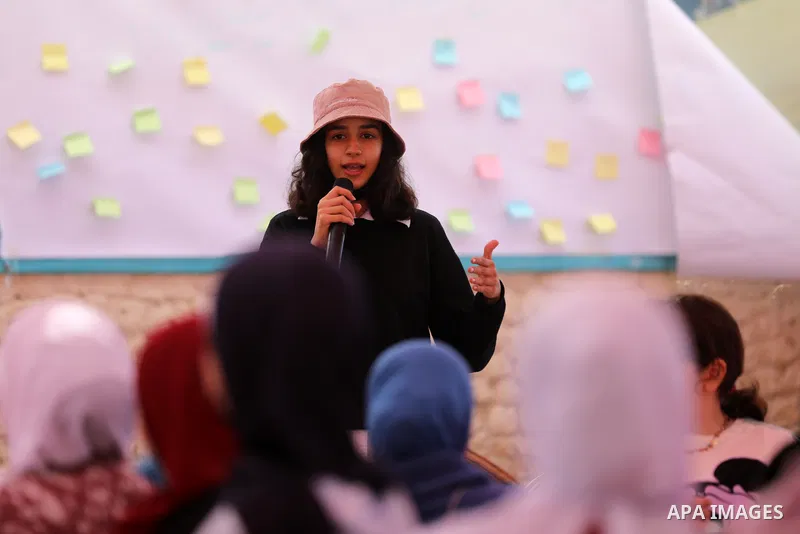 Palestinian girls take part in a fun activity, marking the international day of the girl in Gaza city, on October 25, 2021. The International Day of the Girl Child focuses attention on the need to address the challenges...