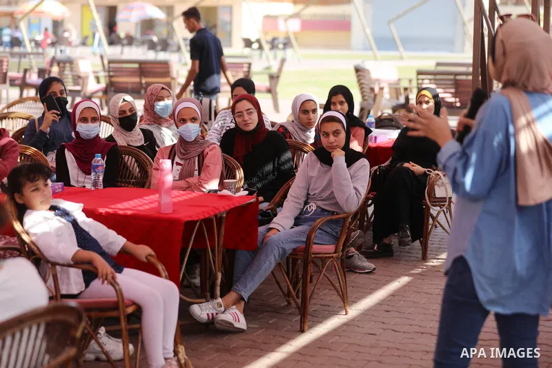 Palestinian girls take part in a fun activity, marking the international day of the girl in Gaza city, on October 25, 2021. The International Day of the Girl Child focuses attention on the need to address the challenges...