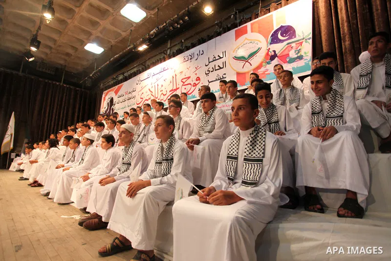 Palestinian children participate in a ceremony to honor the memorizers of the Holy Koran, in Gaza city on October 25, 2021. Photo by Omar Ashtawy