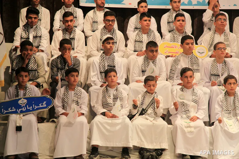 Palestinian children participate in a ceremony to honor the memorizers of the Holy Koran, in Gaza city on October 25, 2021. Photo by Omar Ashtawy