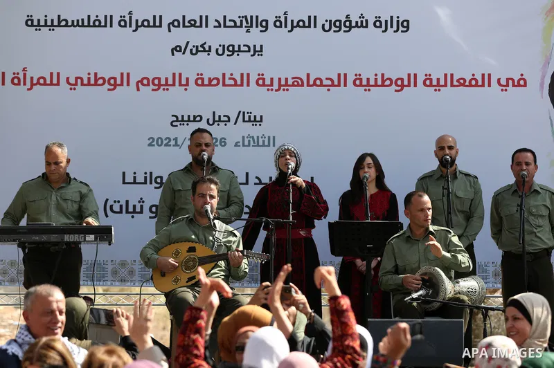 Palestinians attend a festival marking the National Palestinian Women's Day, in the village of Beita in the West Bank city of Nablus on October 26, 2021. Photo by Wajed Nobani