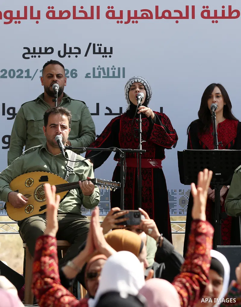Palestinians attend a festival marking the National Palestinian Women's Day, in the village of Beita in the West Bank city of Nablus on October 26, 2021. Photo by Wajed Nobani