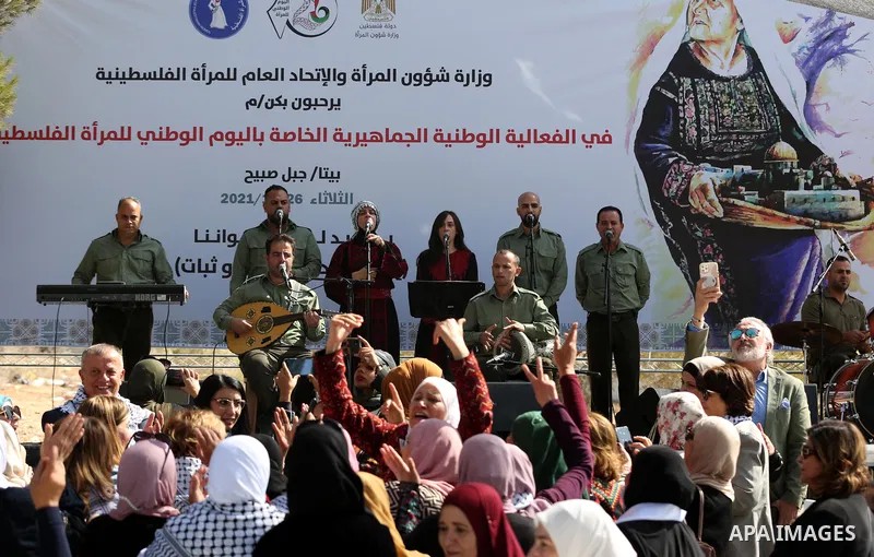 Palestinians attend a festival marking the National Palestinian Women's Day, in the village of Beita in the West Bank city of Nablus on October 26, 2021. Photo by Wajed Nobani