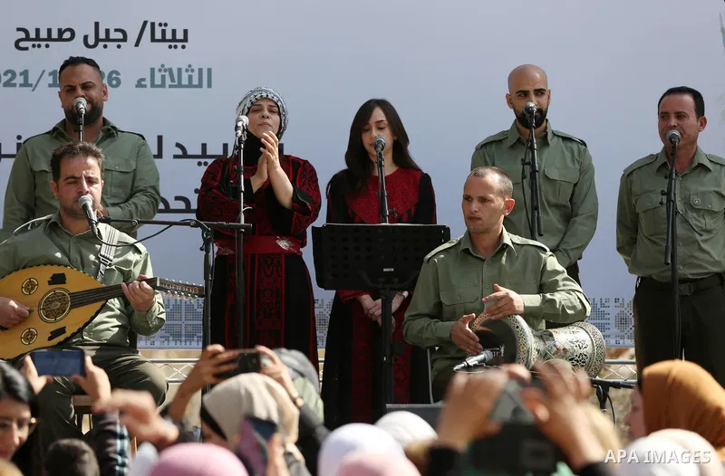 Palestinians attend a festival marking the National Palestinian Women's Day, in the village of Beita in the West Bank city of Nablus on October 26, 2021. Photo by Wajed Nobani