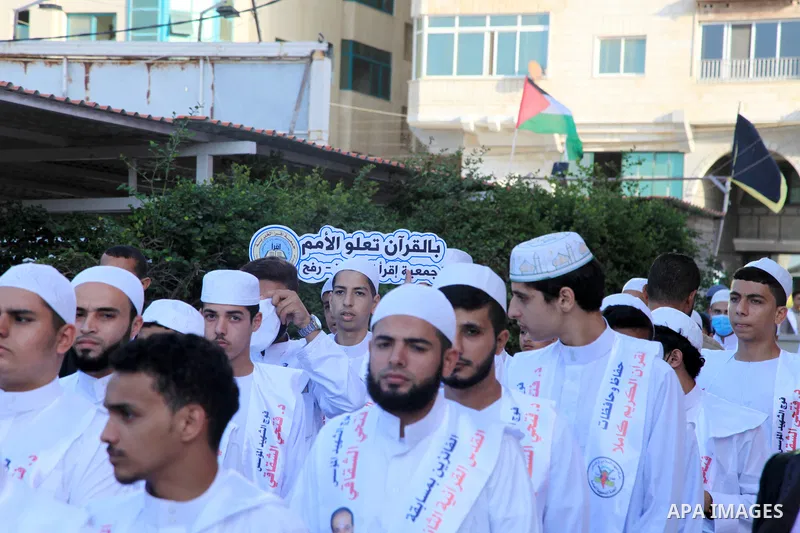 Palestinians participate in a ceremony to honor the memorizers of the Holy Koran, in Gaza city on October 26, 2021. Photo by Omar Ashtawy