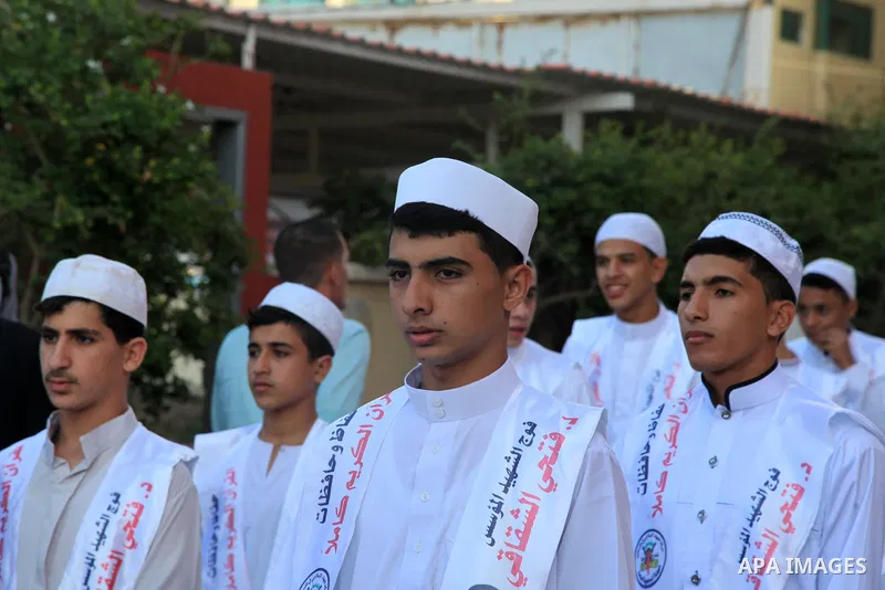 Palestinians participate in a ceremony to honor the memorizers of the Holy Koran, in Gaza city on October 26, 2021. Photo by Omar Ashtawy