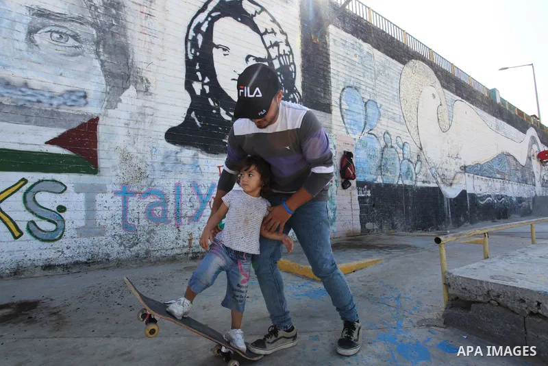 Palestinian girls practice on Skateboard sport at Gaza seaport, in Gaza city on October 27, 2021. A skateboard is a type of sports equipment used for skateboarding. They are usually made of a specially designed 7-8 ply m...