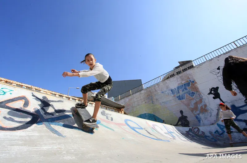 Palestinian girls practice on Skateboard sport at Gaza seaport, in Gaza city on October 27, 2021. A skateboard is a type of sports equipment used for skateboarding. They are usually made of a specially designed 7-8 ply m...