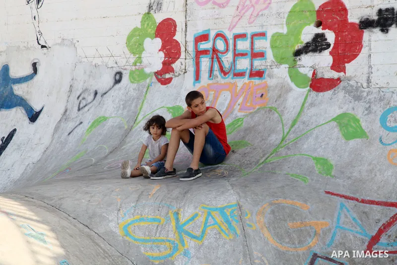 Palestinian girls practice on Skateboard sport at Gaza seaport, in Gaza city on October 27, 2021. A skateboard is a type of sports equipment used for skateboarding. They are usually made of a specially designed 7-8 ply m...