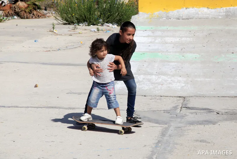 Palestinian girls practice on Skateboard sport at Gaza seaport, in Gaza city on October 27, 2021. A skateboard is a type of sports equipment used for skateboarding. They are usually made of a specially designed 7-8 ply m...