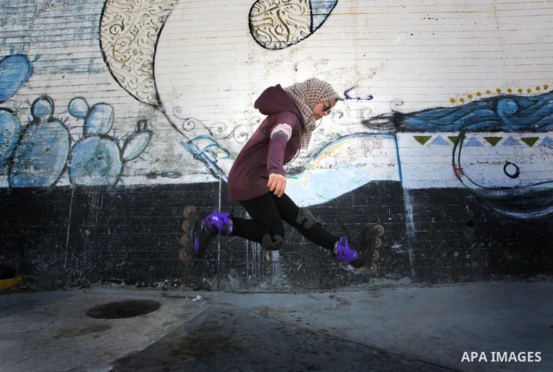 Palestinian girls practice on Skateboard sport at Gaza seaport, in Gaza city on October 27, 2021. A skateboard is a type of sports equipment used for skateboarding. They are usually made of a specially designed 7-8 ply m...