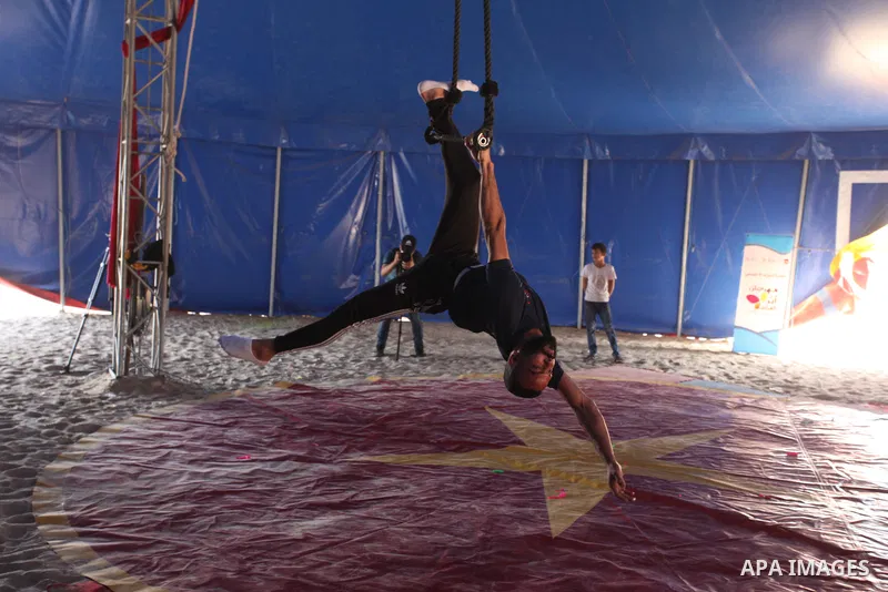 Palestinian children attend a circus performance inside a circus tent, in Beit Hanoun in the nothern Gaza Strip on October 28, 2021. The Gaza Stars School was established in an area of one dunam (1,000 square metres) and...