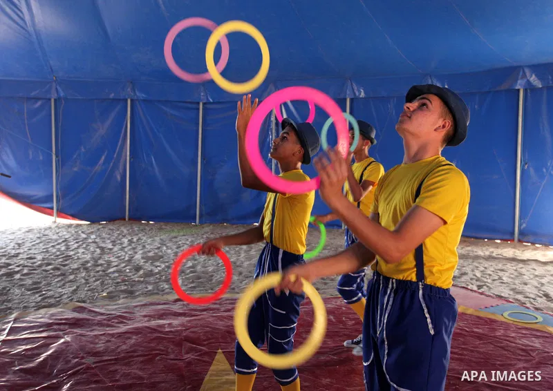 Palestinian children attend a circus performance inside a circus tent, in Beit Hanoun in the nothern Gaza Strip on October 28, 2021. The Gaza Stars School was established in an area of one dunam (1,000 square metres) and...