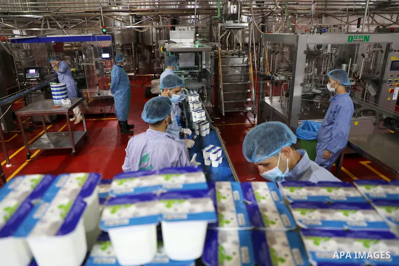 Palestinian employees work at Hanover factory for dairy, in Gaza city, on October 28, 2021. Photo by Majdy Fathi