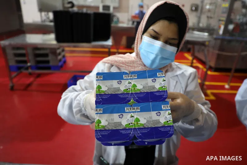 Palestinian employees work at Hanover factory for dairy, in Gaza city, on October 28, 2021. Photo by Majdy Fathi