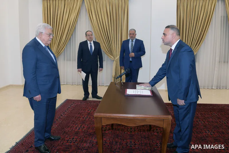 Fayez Abu Aita swear oath in the presence of Palestinian President Mahmoud Abbas as ambassador to the Republic of Algeria, in the West Bank city of Ramallah on October 28, 2021. Photo by Thaer Ganaim