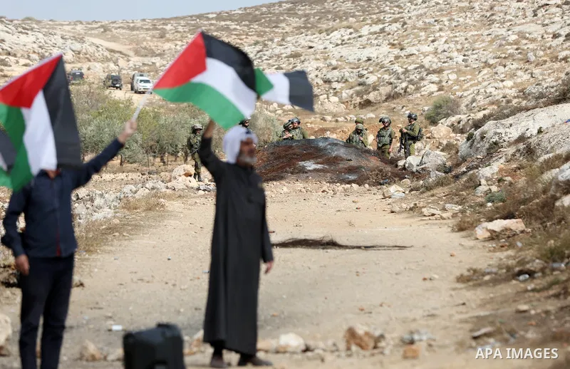 Palestinian protesters clash with Israeli forces during a protest against Israeli settlements, in Beit Dajan, in the West Bank city of Nablus on October 29, 2021. Photo by Stringer