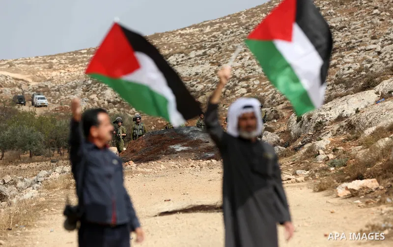Palestinian protesters clash with Israeli forces during a protest against Israeli settlements, in Beit Dajan, in the West Bank city of Nablus on October 29, 2021. Photo by Stringer