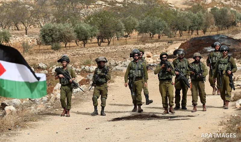 Palestinian protesters clash with Israeli forces during a protest against Israeli settlements, in Beit Dajan, in the West Bank city of Nablus on October 29, 2021. Photo by Stringer
