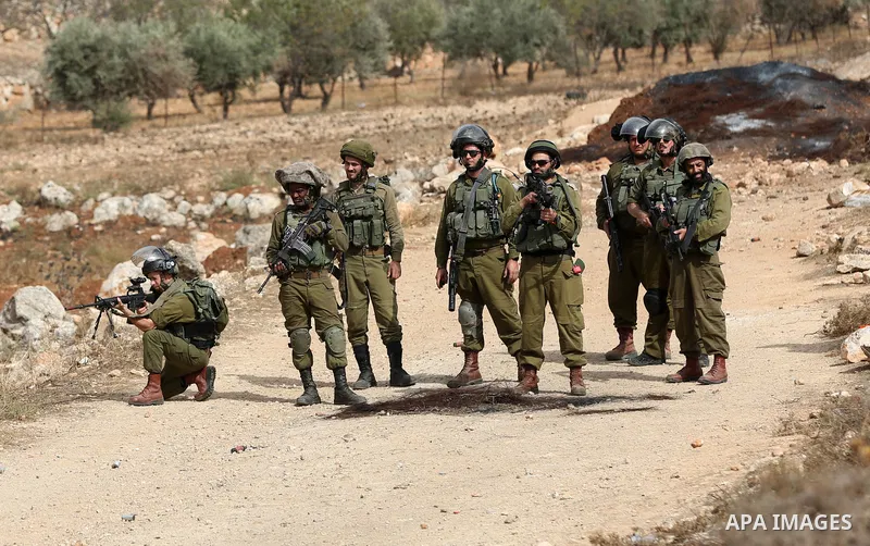 Palestinian protesters clash with Israeli forces during a protest against Israeli settlements, in Beit Dajan, in the West Bank city of Nablus on October 29, 2021. Photo by Stringer