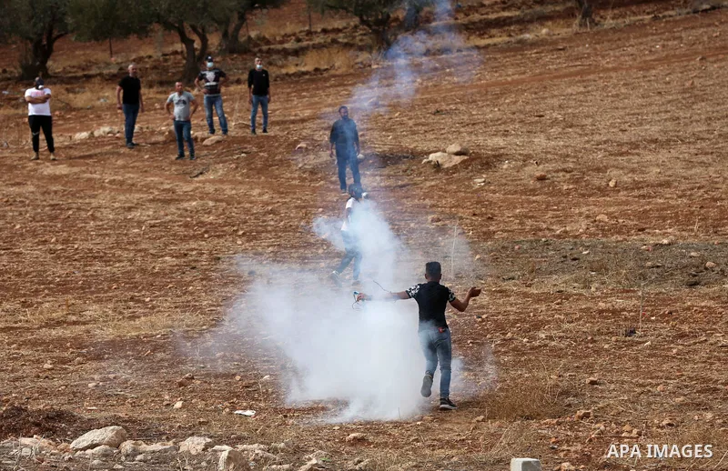 Palestinian protesters clash with Israeli forces during a protest against Israeli settlements, in Beit Dajan, in the West Bank city of Nablus on October 29, 2021. Photo by Stringer