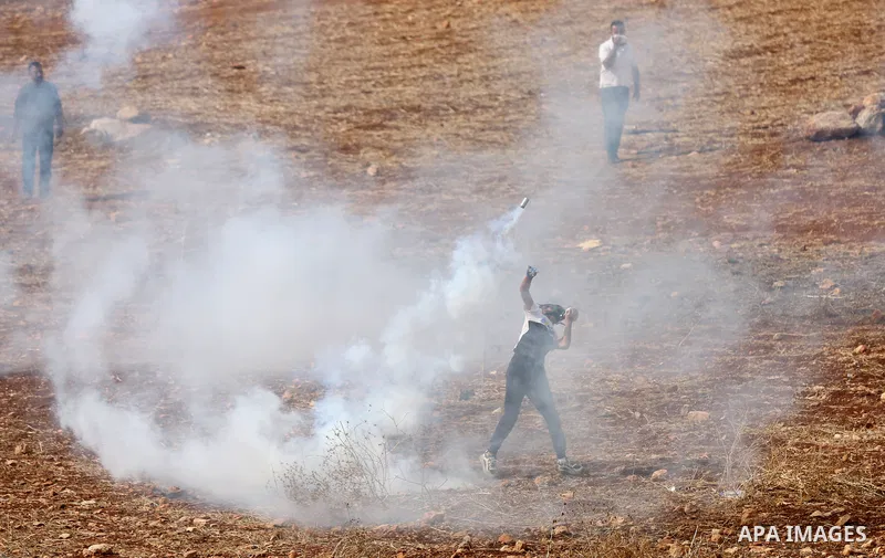 Palestinian protesters clash with Israeli forces during a protest against Israeli settlements, in Beit Dajan, in the West Bank city of Nablus on October 29, 2021. Photo by Stringer