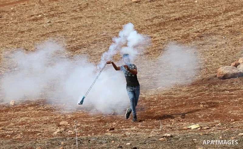 Palestinian protesters clash with Israeli forces during a protest against Israeli settlements, in Beit Dajan, in the West Bank city of Nablus on October 29, 2021. Photo by Stringer