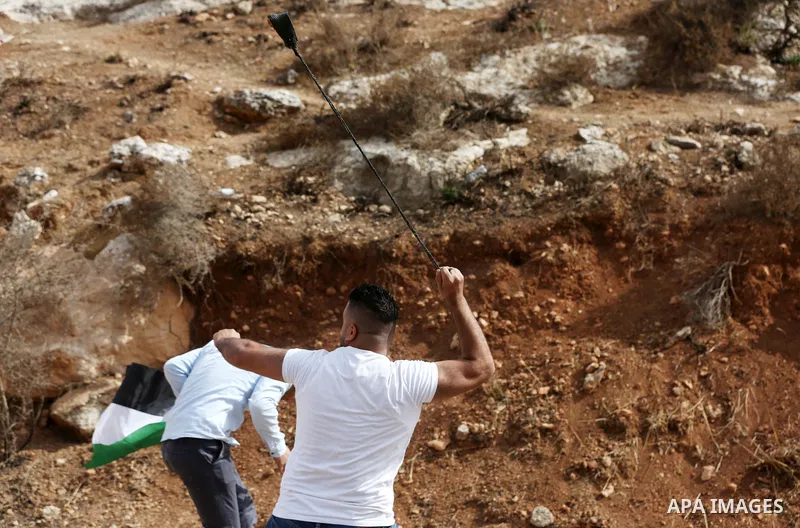 Palestinian protesters clash with Israeli forces during a protest against Israeli settlements, in Beit Dajan, in the West Bank city of Nablus on October 29, 2021. Photo by Stringer