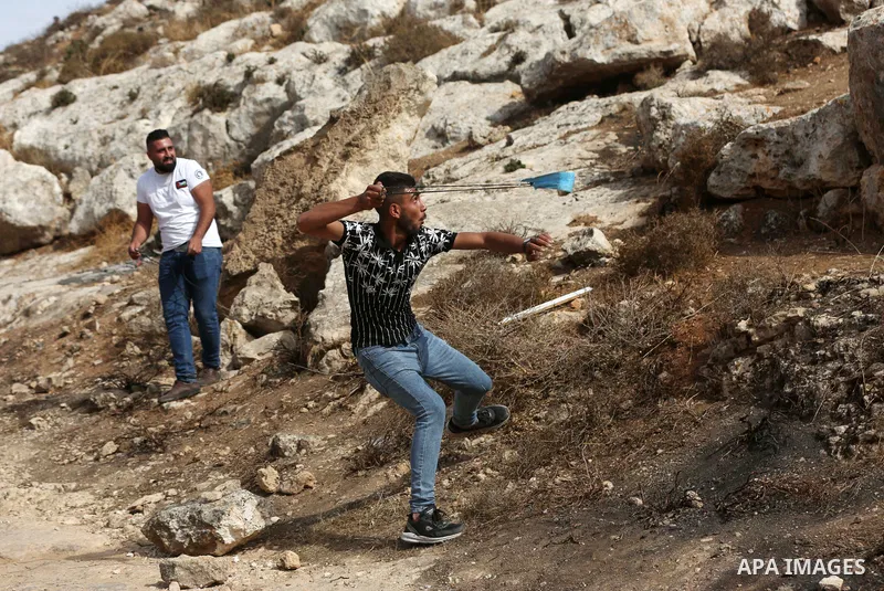 Palestinian protesters clash with Israeli forces during a protest against Israeli settlements, in Beit Dajan, in the West Bank city of Nablus on October 29, 2021. Photo by Stringer