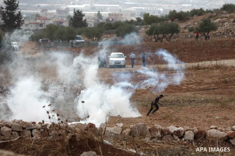 Palestinian protesters clash with Israeli forces during a protest against Israeli settlements, in Beit Dajan, in the West Bank city of Nablus on October 29, 2021. Photo by Stringer
