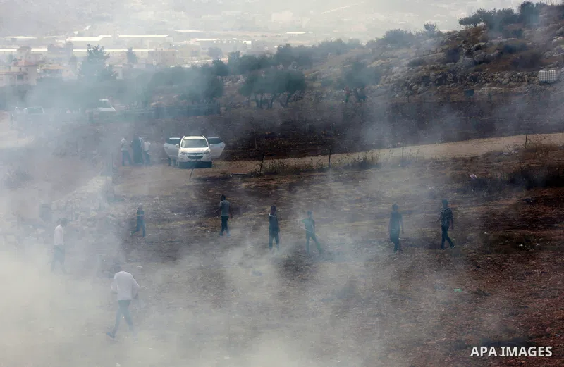 Palestinian protesters clash with Israeli forces during a protest against Israeli settlements, in Beit Dajan, in the West Bank city of Nablus on October 29, 2021. Photo by Stringer